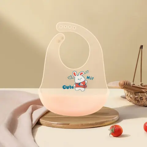 Фото Слюнявчик силиконовый с поддоном Зайчик Cute Hi Персиковый